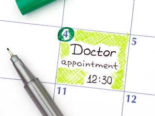 Calendar showing appointment with pen on top
